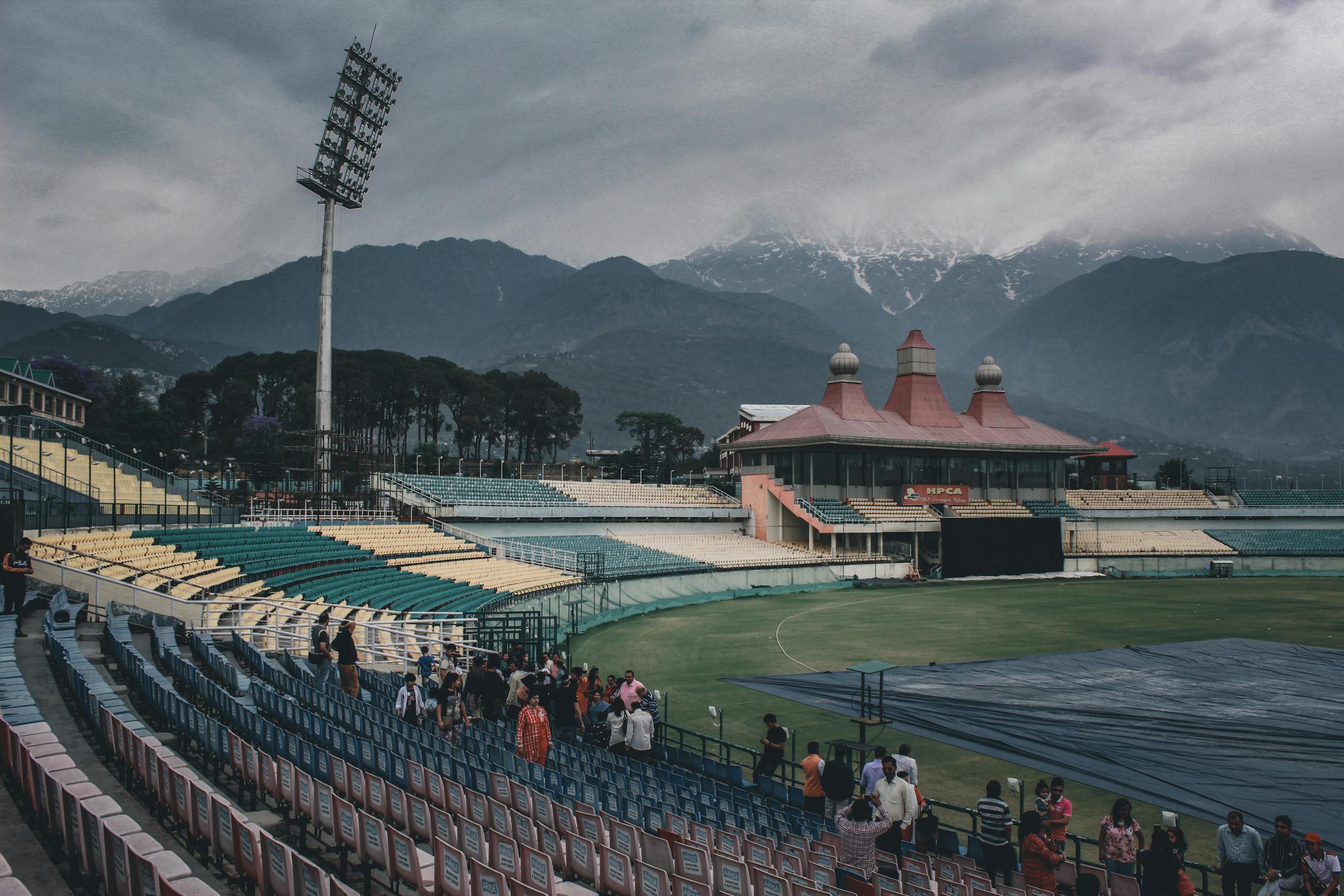 HPCA Stadium in India set against stunning mountains and cloudy skies, capturing the essence of outdoor sports venues.