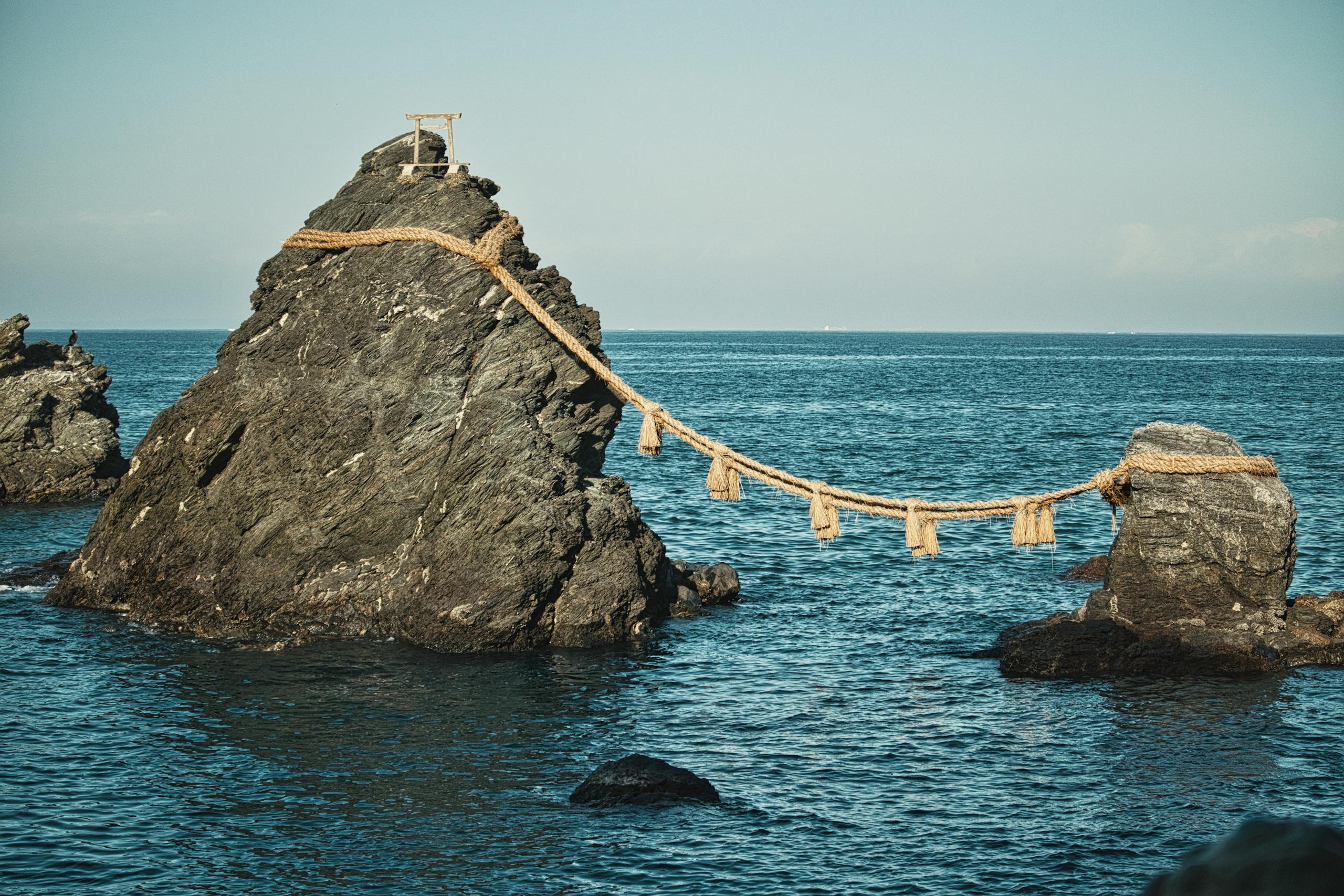 View of Meoto Iwa rocks with sacred rope at Futami Okitama Shrine in Ise, Japan.