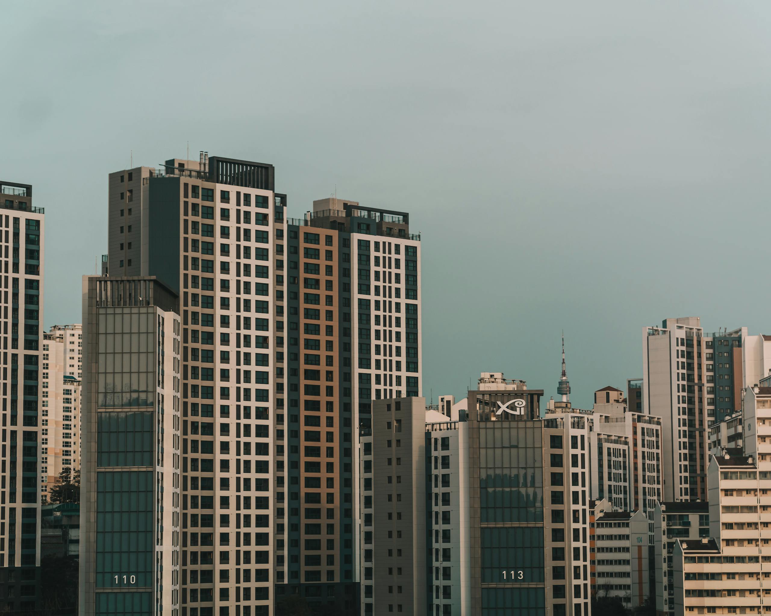 Stunning view of Seoul's modern skyline with glass-clad skyscrapers under a clear sky.