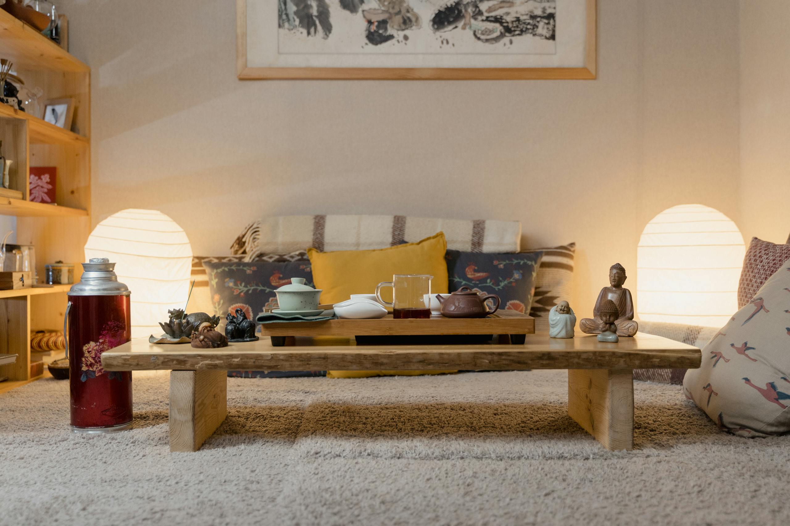 A warm and cozy indoor setting featuring a tea set and home decor for a relaxing teatime.