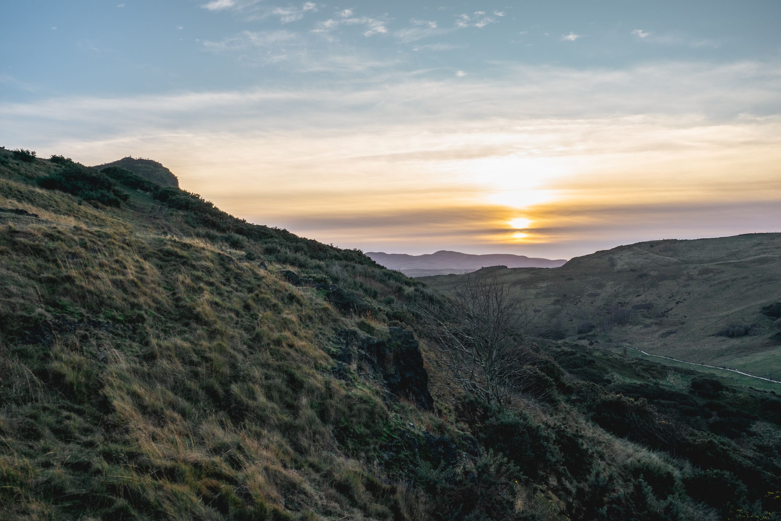 Breathtaking sunset view over Arthur's Seat, Edinburgh. Perfect for nature and travel enthusiasts.