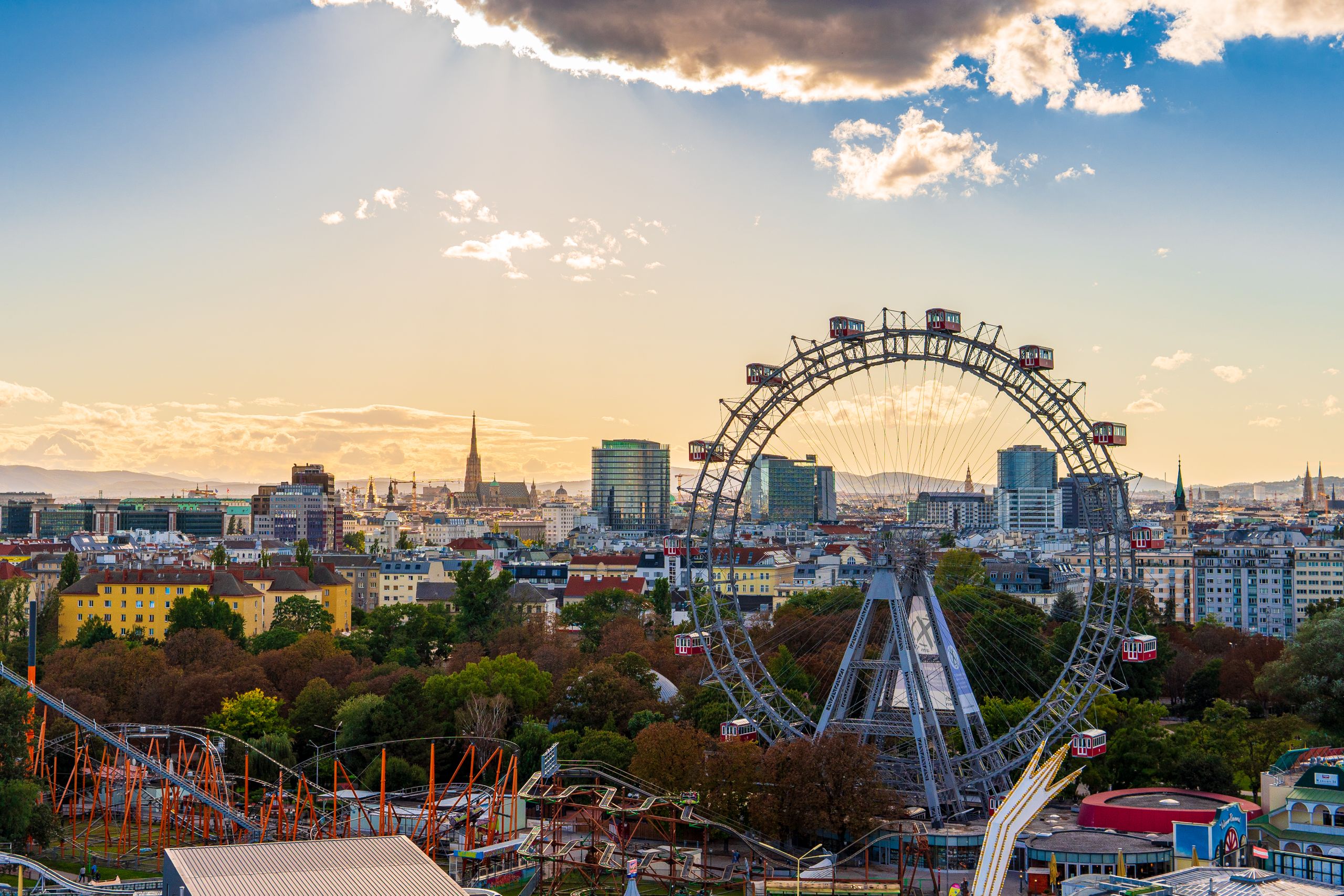 Capture of Vienna cityscape featuring the famous Ferris wheel at sunset.