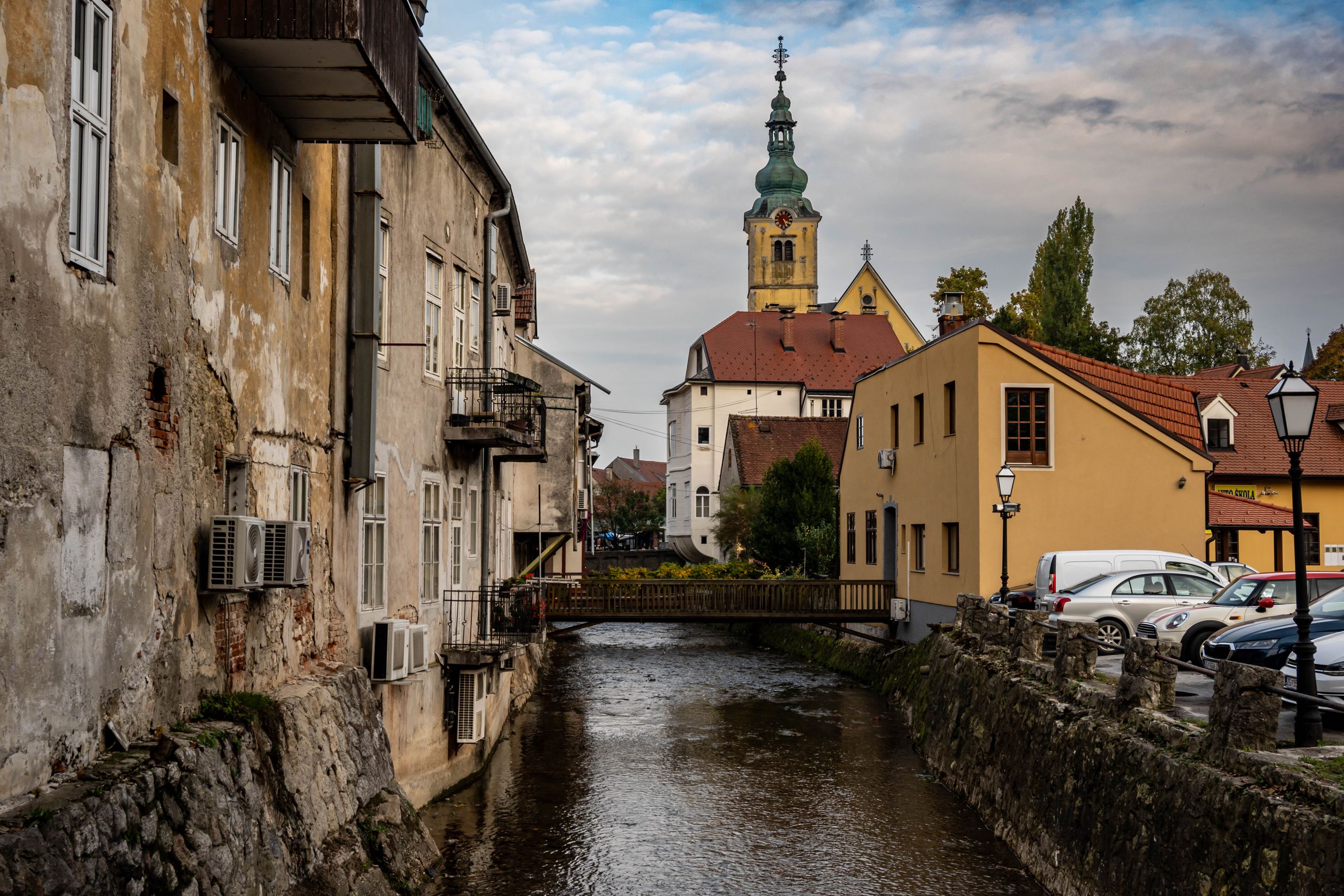 Charming view of Samobor, Croatia with historic architecture and peaceful river canal.